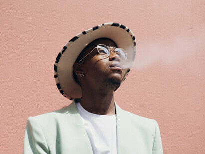 Amidst a backdrop of shifting trends, he embodies the youth's complex relationship with smoking and emerging nicotine products
