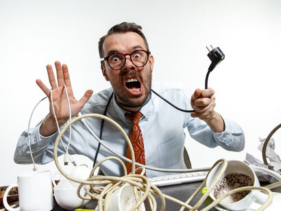 The workplace is filled with a tangle of wires, contributing to the stress and digital anxiety in an already fast-paced world