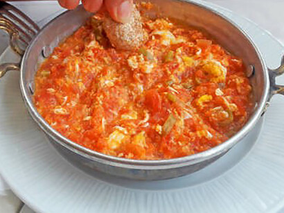 The table boasts a mouthwatering display of menemen, inviting everyone to indulge