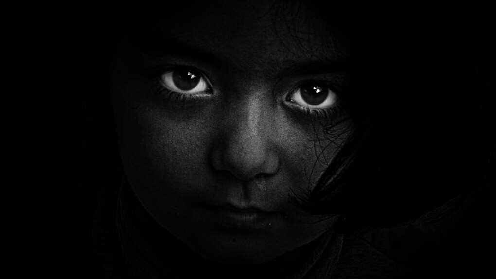 The loss of innocence, the haunting gaze of a child reflects the toll of political unrest
