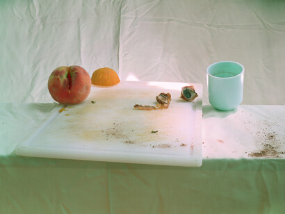 Laura Letinsky, Untitled #64 (Peach Pit, Blue Cap), from the series Hardly More Than Ever, 2002, 30” x 38.34”