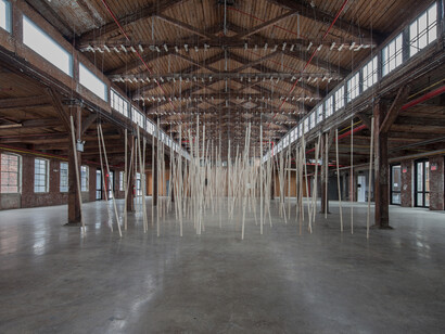 250 prepared ac-motors, 325kg roof laths, 1.8km rope Zimoun 2015. Motors, wood, rope, metal, power supplies. Dimensions: variable. Installation view: Knockdown Center NYC. Photography by Zimoun ©
