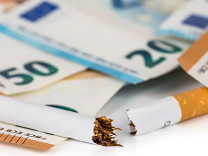Cigarettes with the word 'TAX' on a black background, and cigarettes placed against a backdrop of Euro banknotes