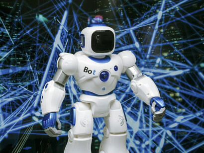 A futuristic white and blue humanoid robot represents the evolution of artificial intelligence