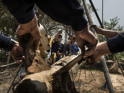 Members of the Dive Team manoeuvre a bomb into place ahead of
being cut, The bomb found in the river in Kratie Province was cut
into sections on site by a team from Golden West. Golden West
developed a UXO harvesting programme were they recycle UXO
into shaped charges which are then used to destroy other pieces of
UXO in the field