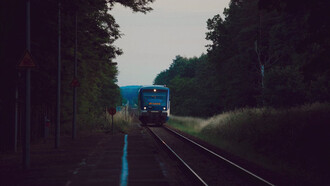 Amidst the train station's buzz, lone travellers wait unseen, challenging stereotypes and embracing the thrill of discovery