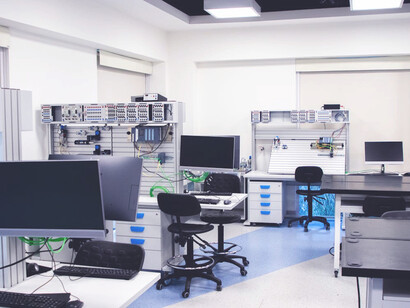 This sleek office space embodies the seamless integration of a tech stack, where every piece of hardware and software works in harmony to convert data into valuable business information