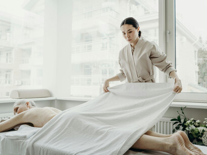 A woman relaxes during a massage therapy session
