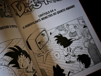 An open Dragon Ball manga featuring Goku and other characters, symbolising how Japanese storytelling can absorb outside influences and alter them into new cultural expressions