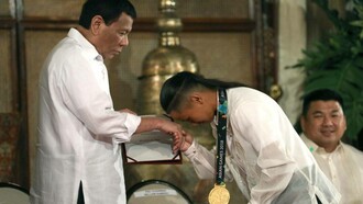 skater Margielyn Didal shows respect to President Rodrigo Roa Duterte at Malacañan Palace, Manila, Philippines, 2018