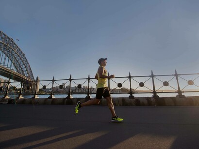 A man jogging near the pier as a form of staying healthy and controlling his ADHD naturally