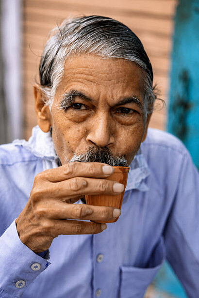 Portrait of an elderly man drinking traditional chai in Jaipur, India
