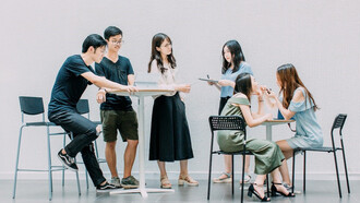 Two men and four women meeting in office