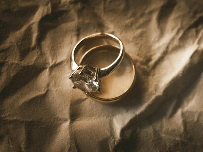 Wedding bands displayed together, reflecting the social expectations and traditions surrounding marriage