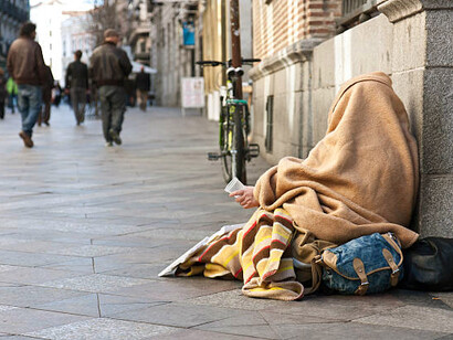 Homeless man on the street, embodying the struggles of poverty and health inequality