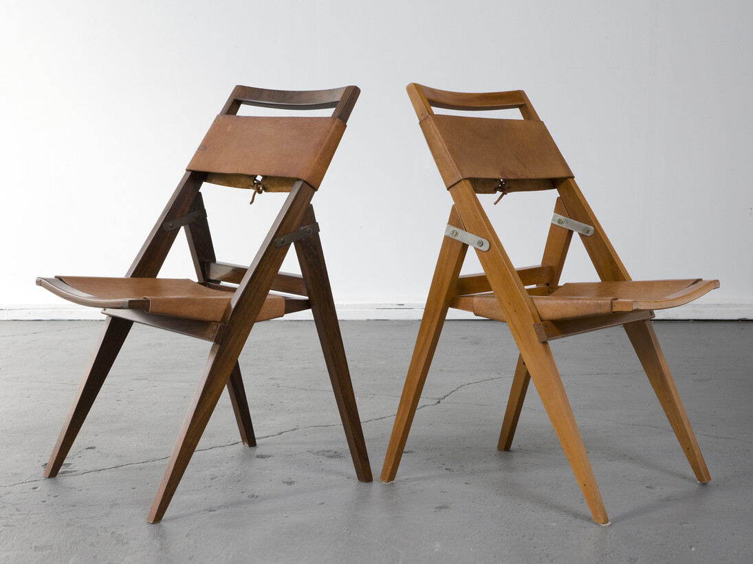 Folding chair with jacaranda frame and leather seat. Designed by Lina Bo Bardi for Studio de Arte Palma, Brazil, circa 1950. (seat height: 16.5") 17.75" L x 16.75" W x 32.25" H / 45.1cm L x 42.5cm W x 81.9cm H. Photo: Joe Kramm/R & Company.