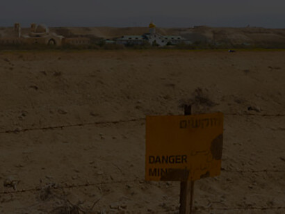 Discover the implications of mine fields encircling the Baptismal Site of Jesus Christ - Qasr el Yahud, situated near Jericho in Israel