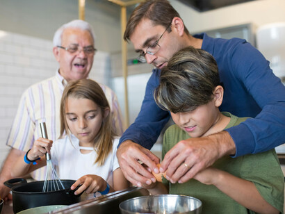 Family cooking together in the kitchen