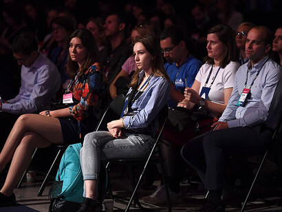 Audience members are watching a presentation at the Future Societies Stage during the second day of Web Summit 2017 at the Altice Arena in Lisbon, Portugal