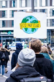 Man holding sign for the Fridays for Future Bonn, global environment protest, 2021