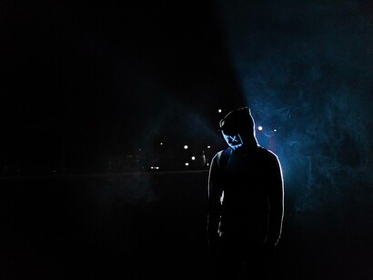 A person walking in darkness