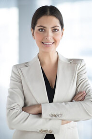 Confident and accomplished businesswoman with arms crossed, symbolizing economic participation, women in business, and female entrepreneurship