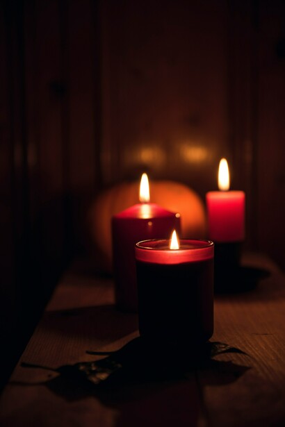 Candles standing resilient in the dark despite the risk of failure