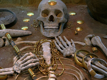 The Varna Necropolis, discovered in 1976 and dated to the 5th millennium BCE, contains graves with the earliest known worked gold. One burial, believed to belong to a 35-year-old elite individual, included a golden scepter, large gold armbands, cloak fasteners, and copper and stone axes
