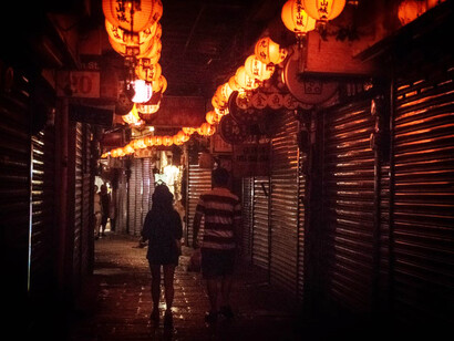 Orange pendant lamps glowing at night, reflecting Taiwan's vibrant culture
