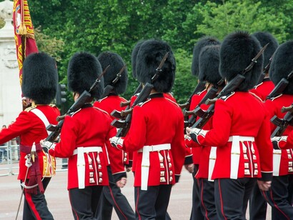 British royal guards marching with unwavering precision, symbolising discipline that outlived the empire it once protected