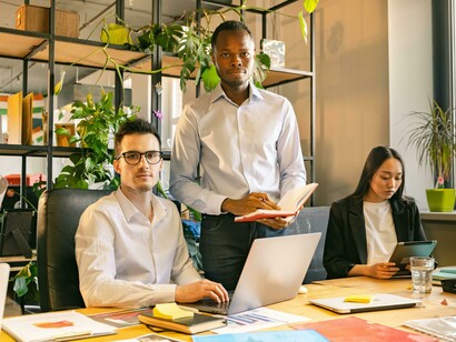 A diverse group of colleagues working together in an inclusive office setting