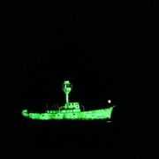 Dorothy Cross, Ghost Ship, 1999 , Two light ship models, phosphorescent paint and u.v.lights, video, 10 minute loop, Collection Irish Museum of Modern Art, Purchase, 2003