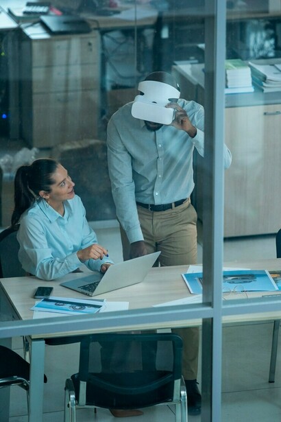 Industrial designers collaborating with AI to create 3D models, demonstrating the role of artificial intelligence in the workplace and its impact on the future of automation across industries