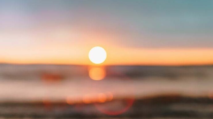 A beach during sunset represents freedom from cages we sometimes build for our fondest memories