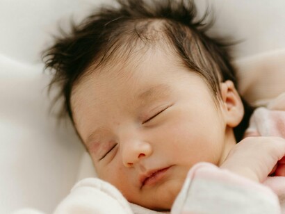 Un bambino che dorme... tenero come una coscina di pollo!