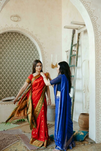 Women dressed in traditional Indian sarees, showcasing Banarasi silk