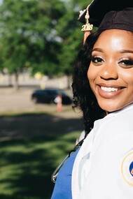 A woman who recently graduated from a higher learning academy is a feat of success
