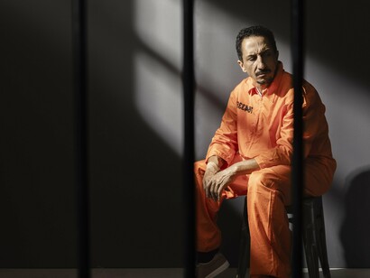 This confined body in harsh light embodies a broken promise—where mass incarceration replaces the social solidarity needed to grow sovereign, creative citizens