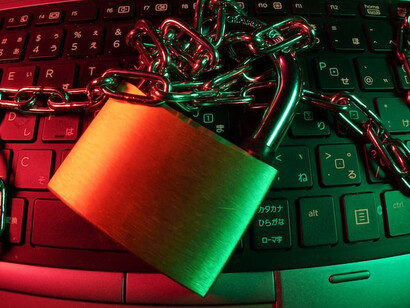 A bold red padlock positioned on a sleek black computer keyboard serves as a potent emblem of cybersecurity