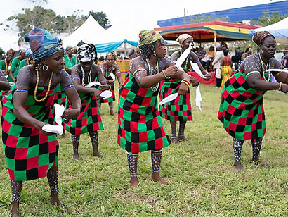 Elegantly adorned in vibrant Kente cloth, women radiate cultural pride and grace during the 2019 Kente Festival in Ghana