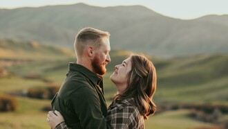A couple embracing while gazing into each other’s eyes