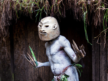 Gazing through an eyeless clay mask, an Asaro Mudman enacts a ritual dance that echoes through time, celebrating his enduring heritage and communal bonds