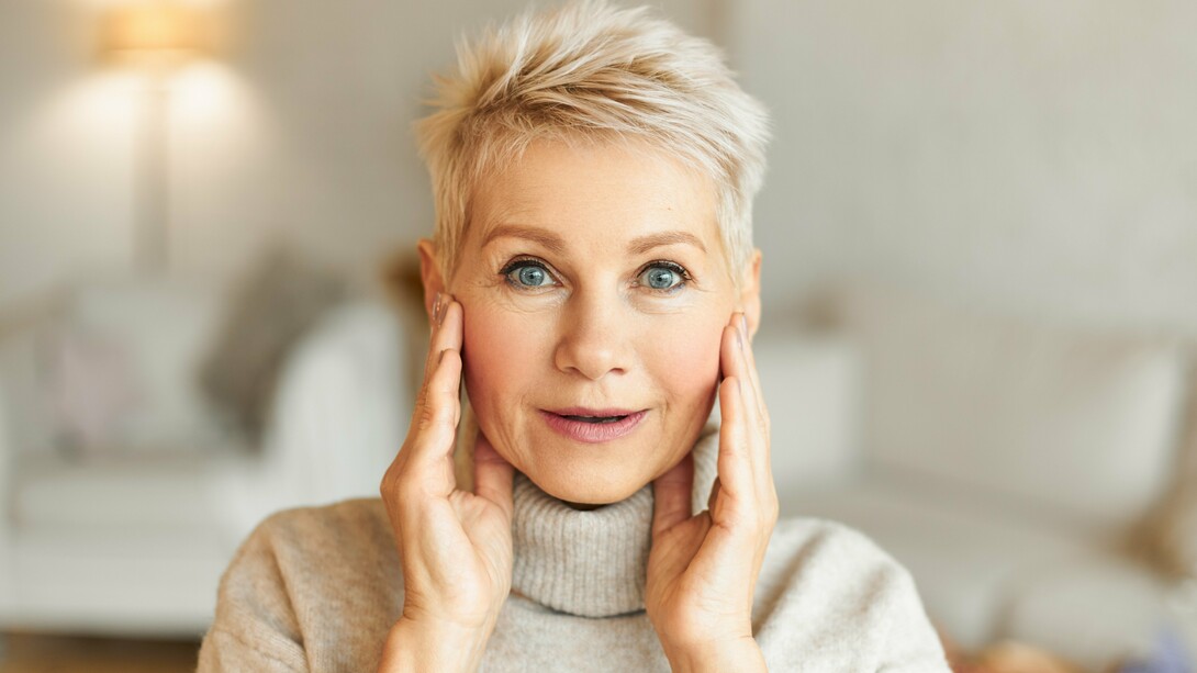 An energetic older woman with glowing skin, capturing the goal of increasing vitality rather than chasing immortality