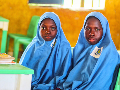 Girls attending school, reflecting the importance of keeping children in classrooms rather than marriage arrangements