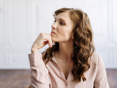 A woman contemplates deeply after a transformative session with a psychologist