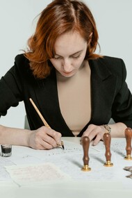 A woman writing down her memoir