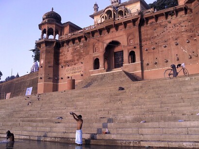 Taking dips (not bathing), an act of cleansing before proceeding to the temple for darshan is a common practice here, Varanasi, India