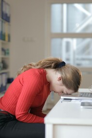 Woman asleep at her desk