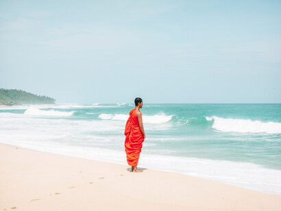 A monk contemplates the sea and the energy it contains