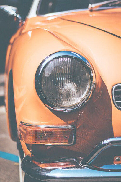 A photo of an orange vintage car